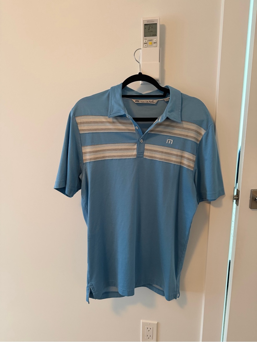 Travis Mathew Blue Golf Shirt with Taupe and White Stripes